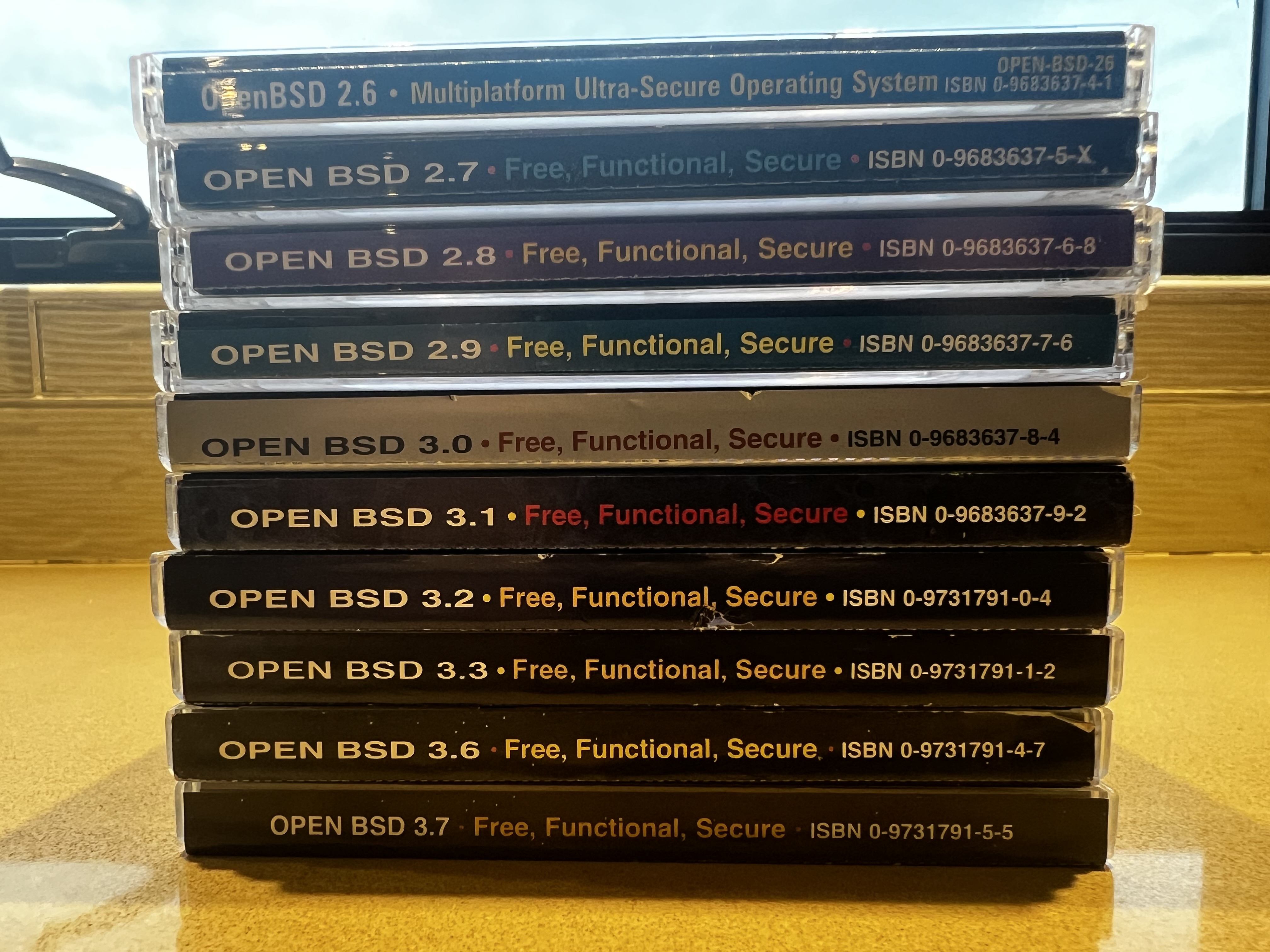 stack of OpenBSD CDs